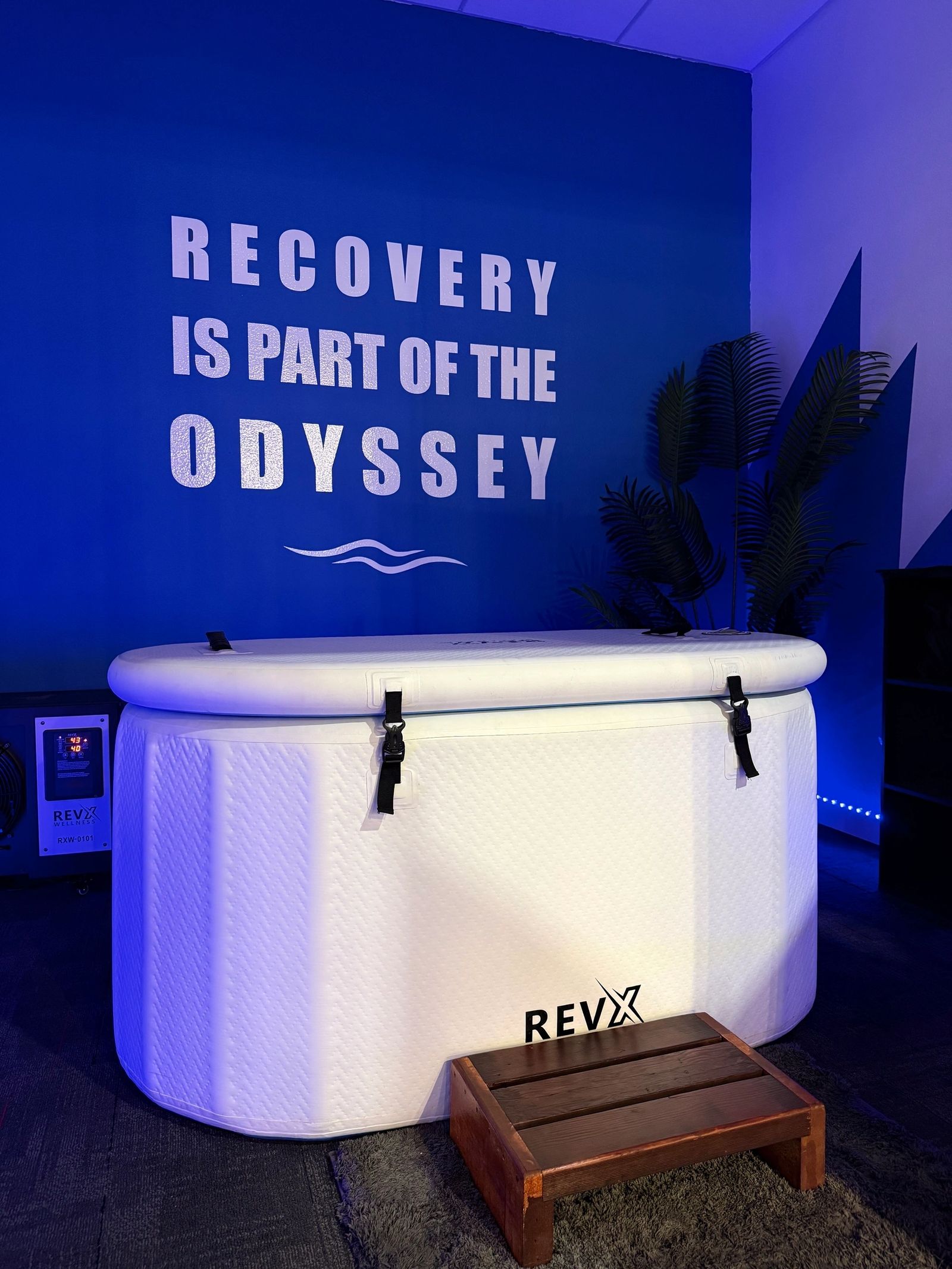 The Odyssey cold plunge beneath a wall reading Recovery is part of the Odyssey